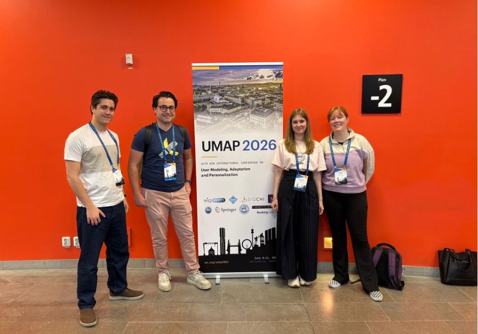 Four MediaFutures researchers standing in front of the ACM UMAP 2026 conference banner in Gothenburg.